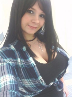 amateur photo Great cleavage in a plaid shirt