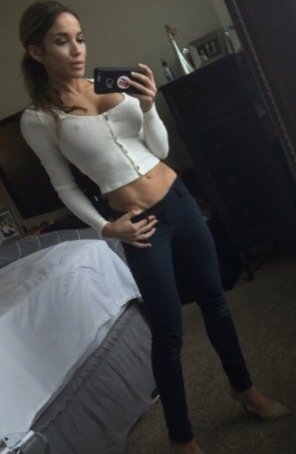 Love this super skinny chick with huge fake tits that she loves showing off