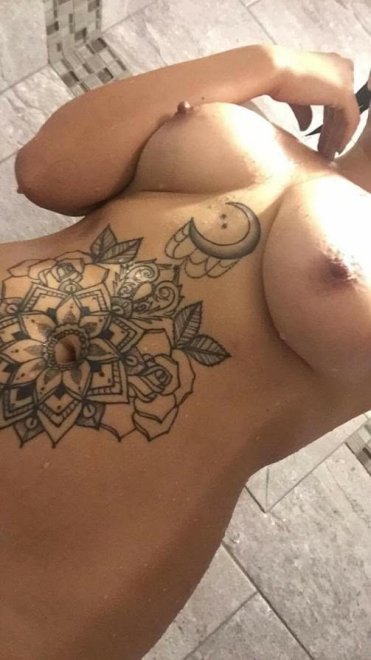 Tattoo'ed sluts chest peice and tits
