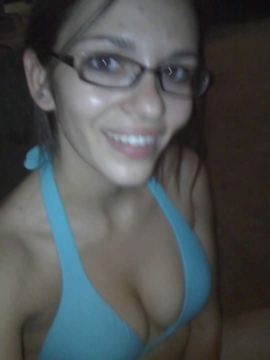 Sexy brunette with glasses showing off some cleavage Porn Pic - EPORNER