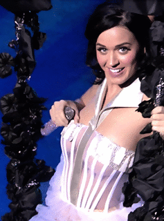 Katy Perry adjusting her top 
