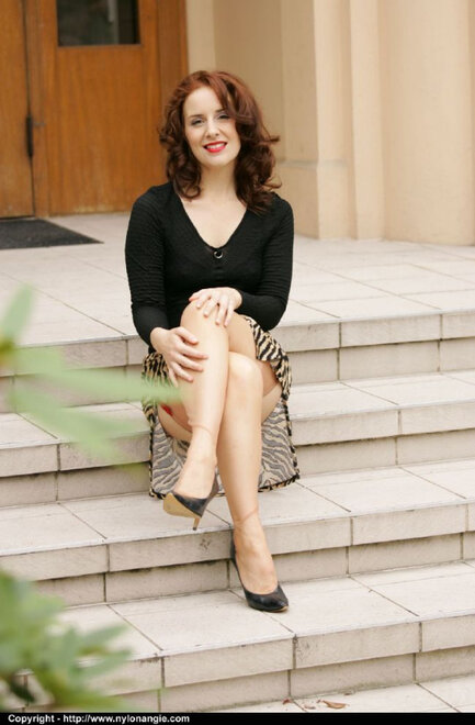 Natural redhead slides her upskirt panties aside on front steps in nylons