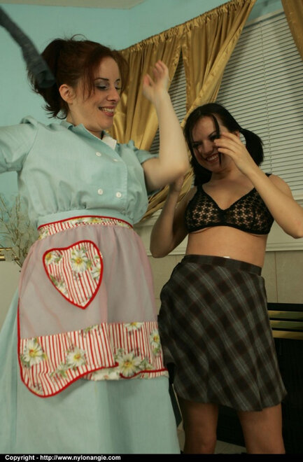 Older maid strips a younger coworker to her knickers and nylons at work_0006