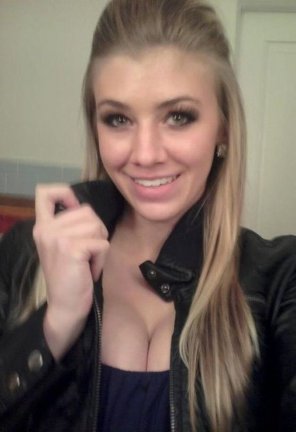 Busty Blonde in Leather Jacket