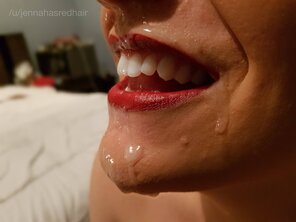 Red lips and cum sliding down my chin.