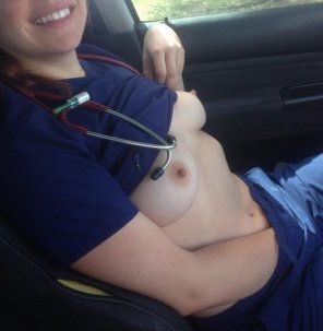 Nurse taking a break in her car.