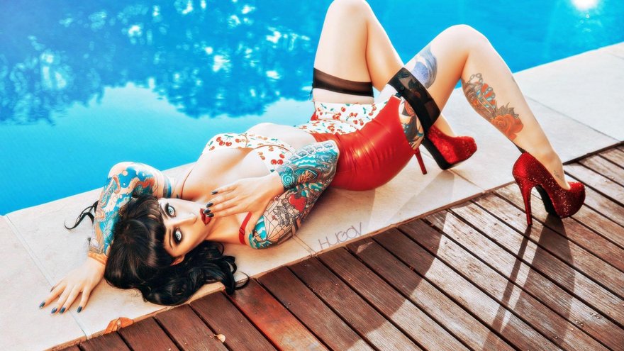Tattooed Pinup Girl in Latex and Heels