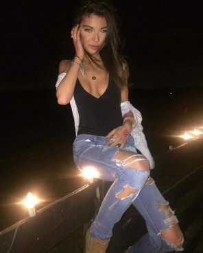 Ripped jeans and braless