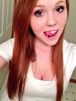 Sexy girl with pierced tongue
