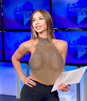 amateur photo TV host and a chainmail top