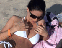 amateur photo Flashing her boobs on the beach 