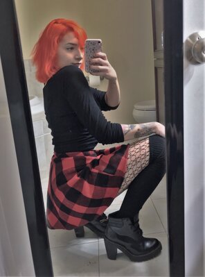 zdjęcie amatorskie Cutie with orange hair dropping it low in thigh high socks with fishnets under them