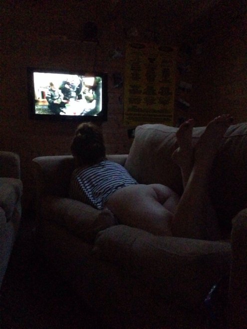 Watching TV, distracted by booty.