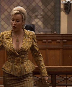 9530-actress-jennifer-tilly-showing-her-cleavage-amp-a-downblouse-in-liar-liar-1997