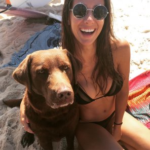 With her dog on the beach