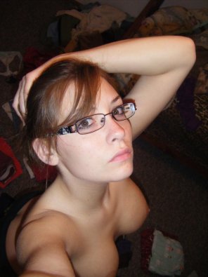 amateur photo Redhead in glasses topless