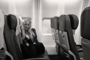 amateur photo Exposing her tits on an empty airplane