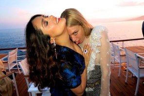 Salma Hayek and Chloe Sevigny licking her chest.