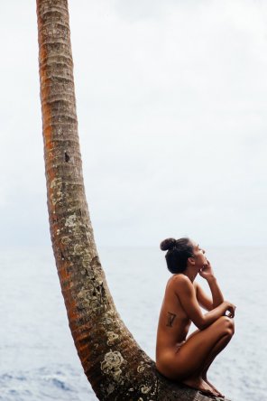 Naked girl and very tall tree