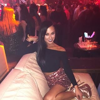 Sexy posing bottle service chick waiting for it