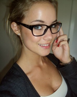Perfect blonde wearing sexy glasses