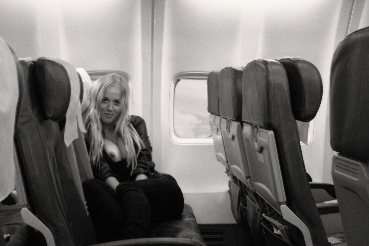 Exposing Her Tits On An Empty Airplane Porn Photo Exposing Her Tits On An Empty Airplane Porn Photo