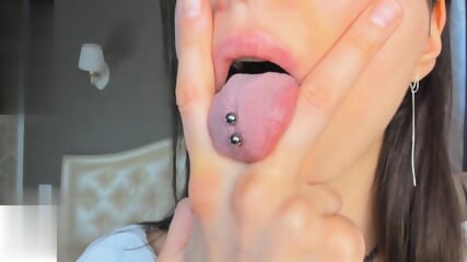 Teen With Tongue Piercings Spits
