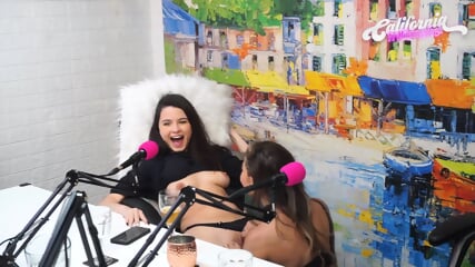 Flavia Oliver performs oral sex on Natasha Steffens during the recording of the California Podcast