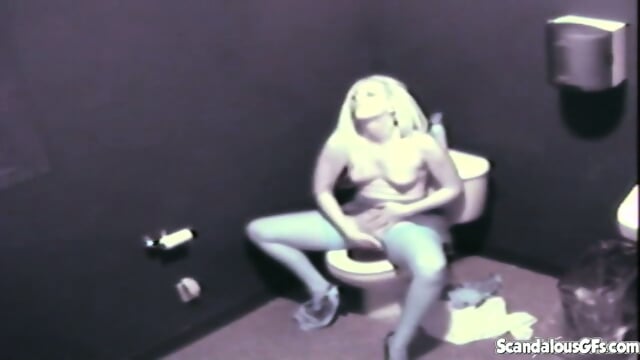Sexy blonde on a toilet fingering her pussy