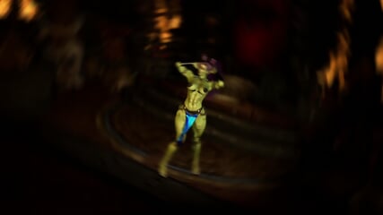 Muscular feral orc queen in bikini armor dancing and flexing her biceps