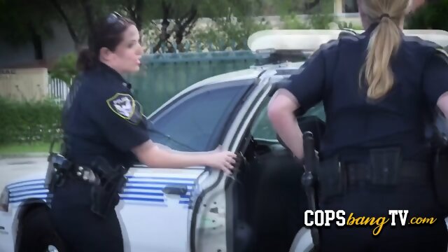 This black stud is ready to fuck with two stunning female cops in public.