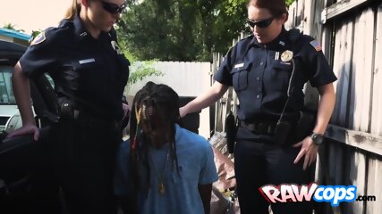 Black Suspect Is Getting A Deep Throat After Being Apprehended By Two Hot MILFs With Big Tits.