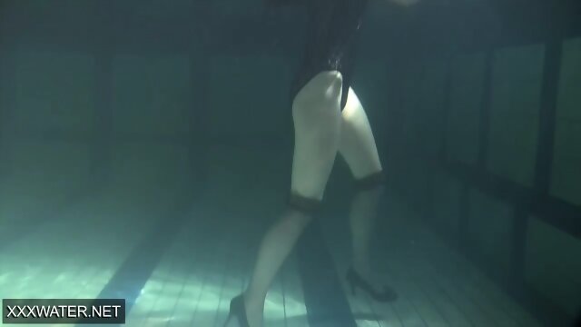 Shaved brunette sissy Irina Polcharova naked in pool