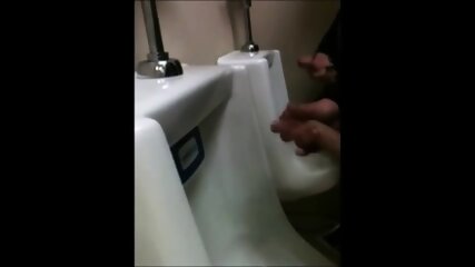 Two Slim Dicks Getting Wanked At The Urinals