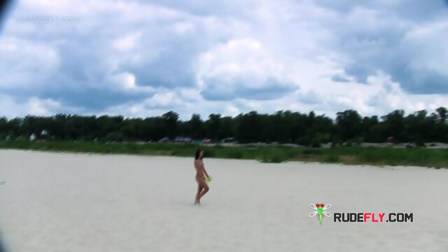 Two young nudist friends love going to the beach together