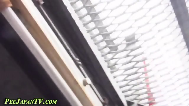 Pissing asian followed